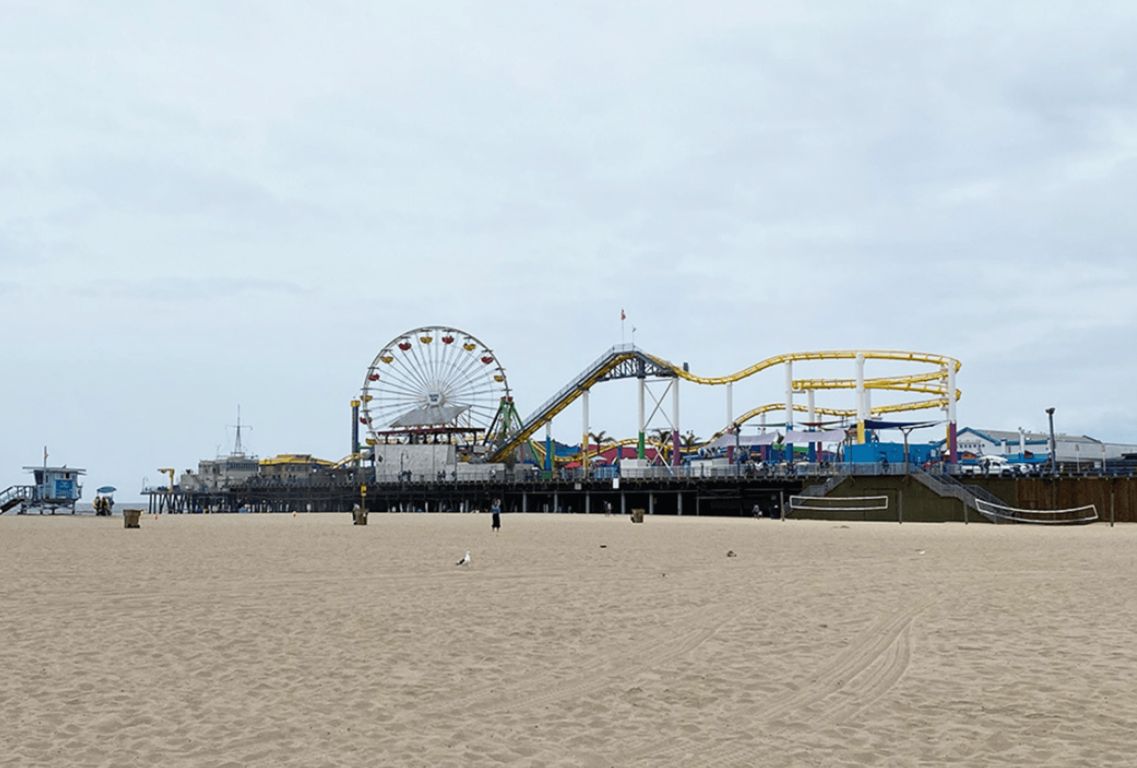 A theme park stretches over the sand on the Santa Monica Pier