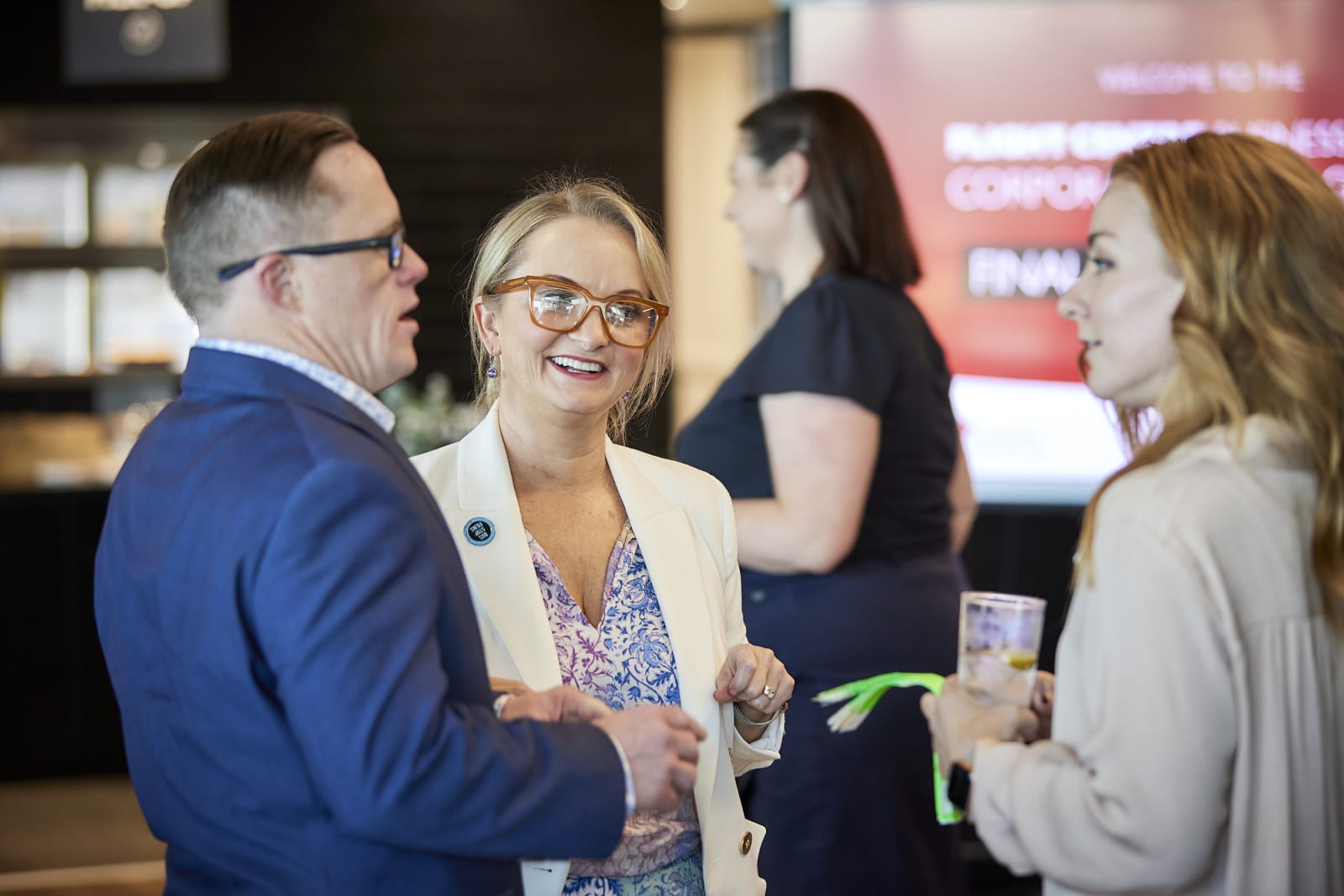 The team from Bus Stops films chatting to Flight Centre Business Travel