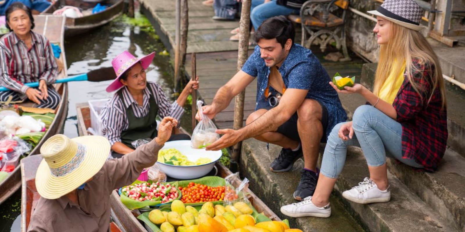 People buying food from the floating markets
