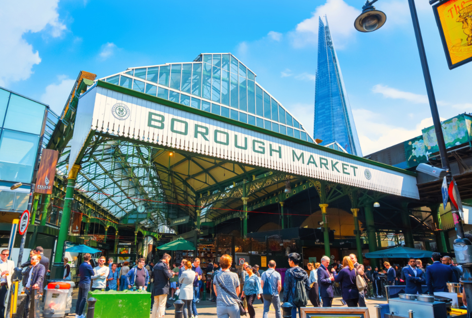 People mill around Borough Market in Southwark, London