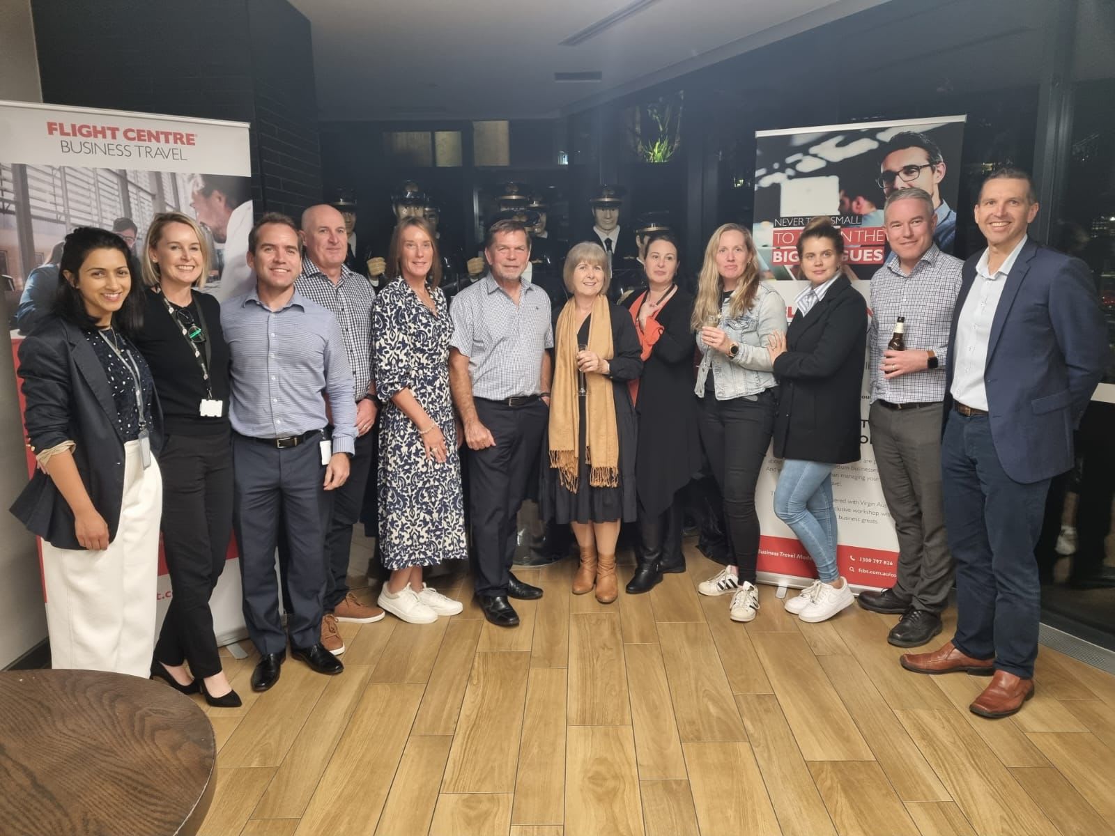 Group shot of business people at a Flight Centre Business Travel meeting