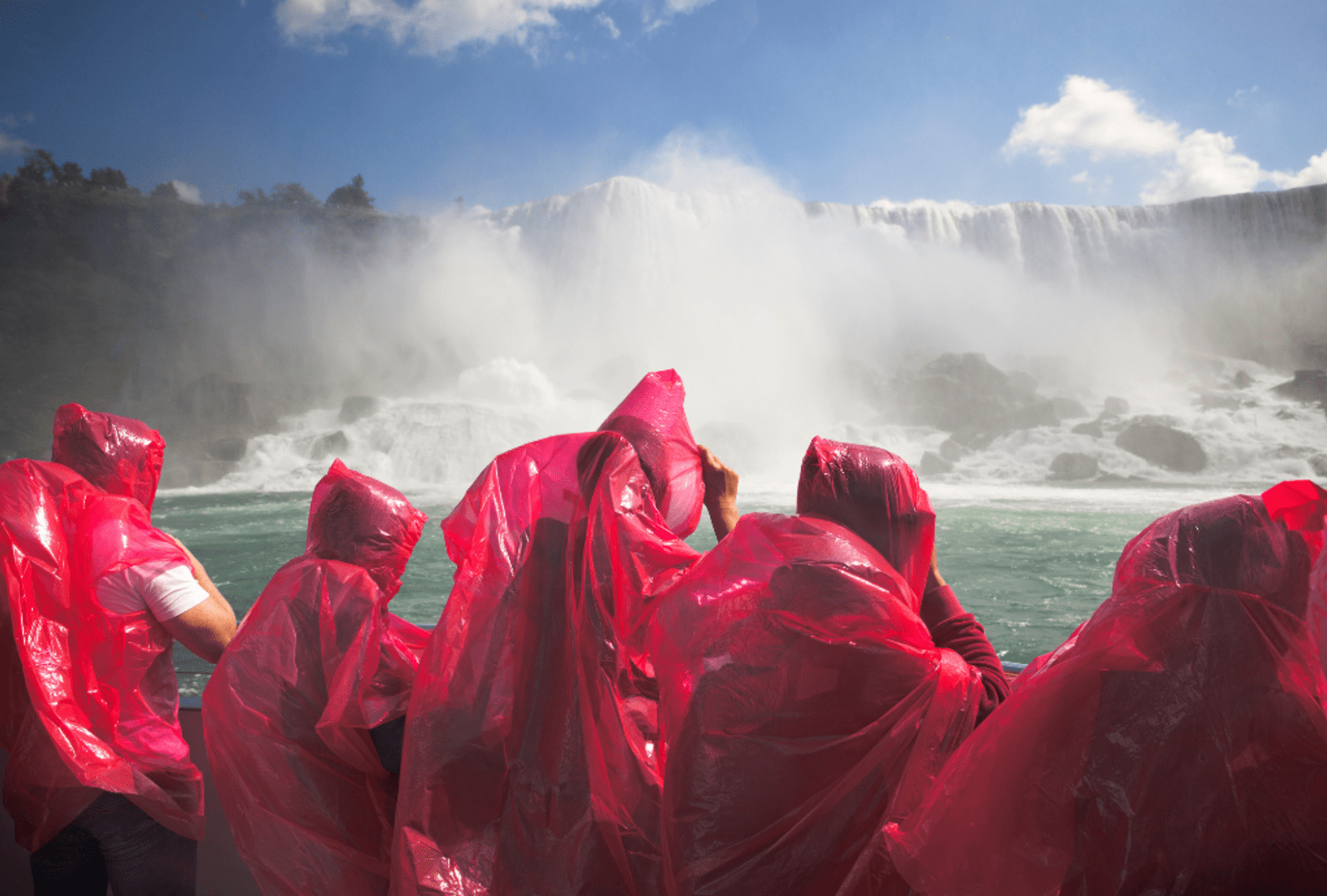 The Niagara Falls sprays tourists in a viewing boat