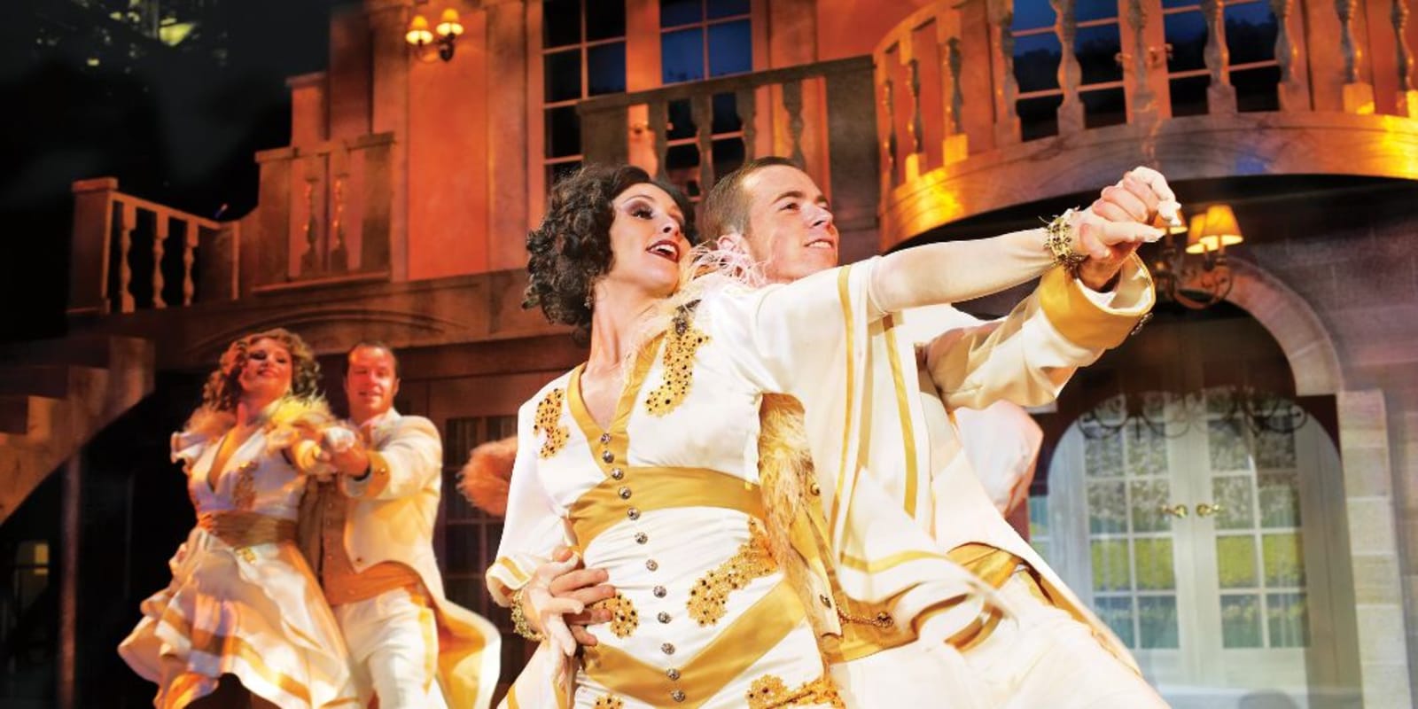 A group of dancers performing on a stage