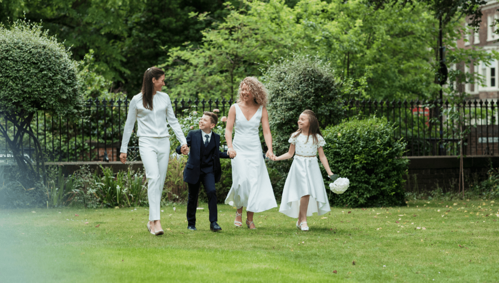queer couple with children getting married in garden in London