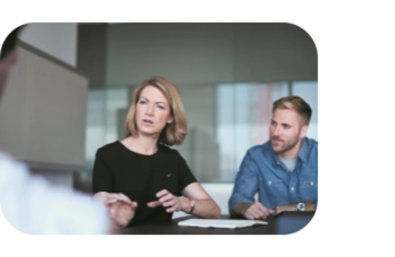 man and woman having meeting in conference room