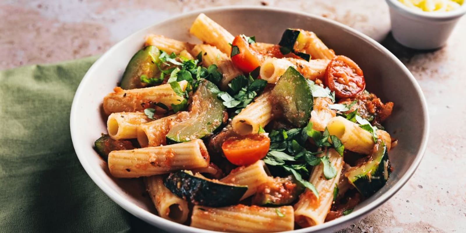 A bowl of homemade pasta with assorted vegetables