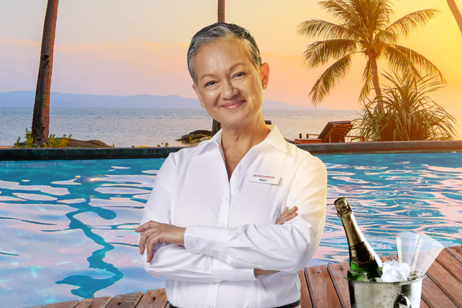 Travel Expert by the pool with a bottle of champagne