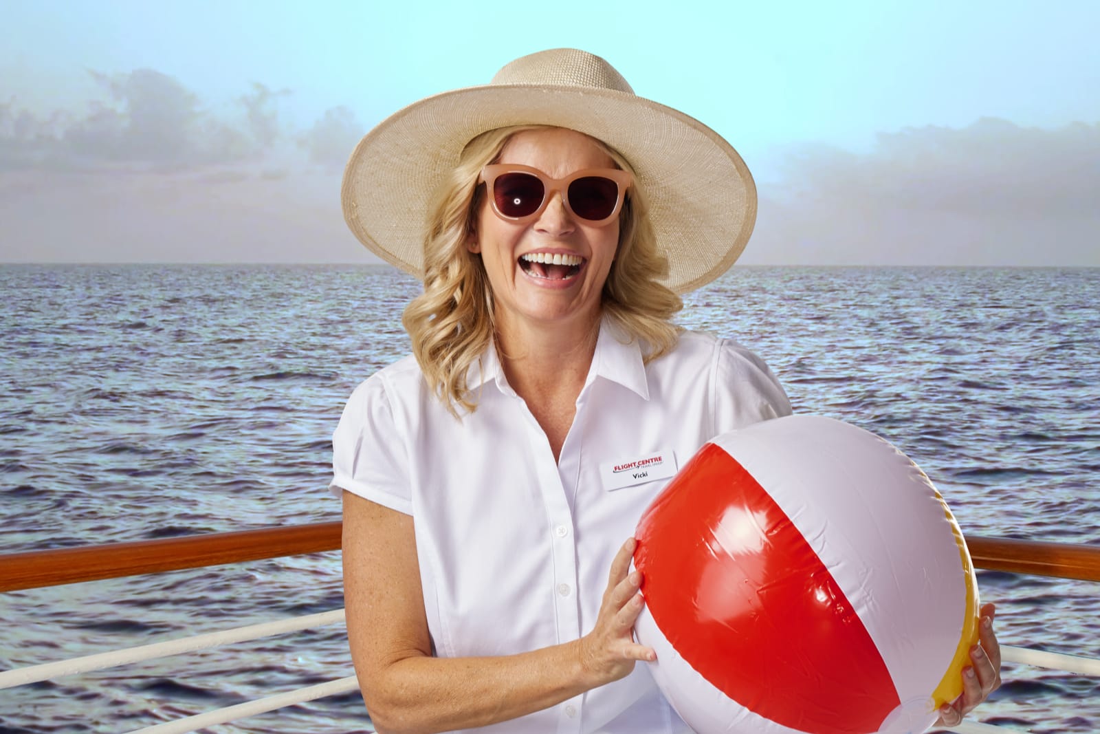 Lady holding beach ball on cruise ship