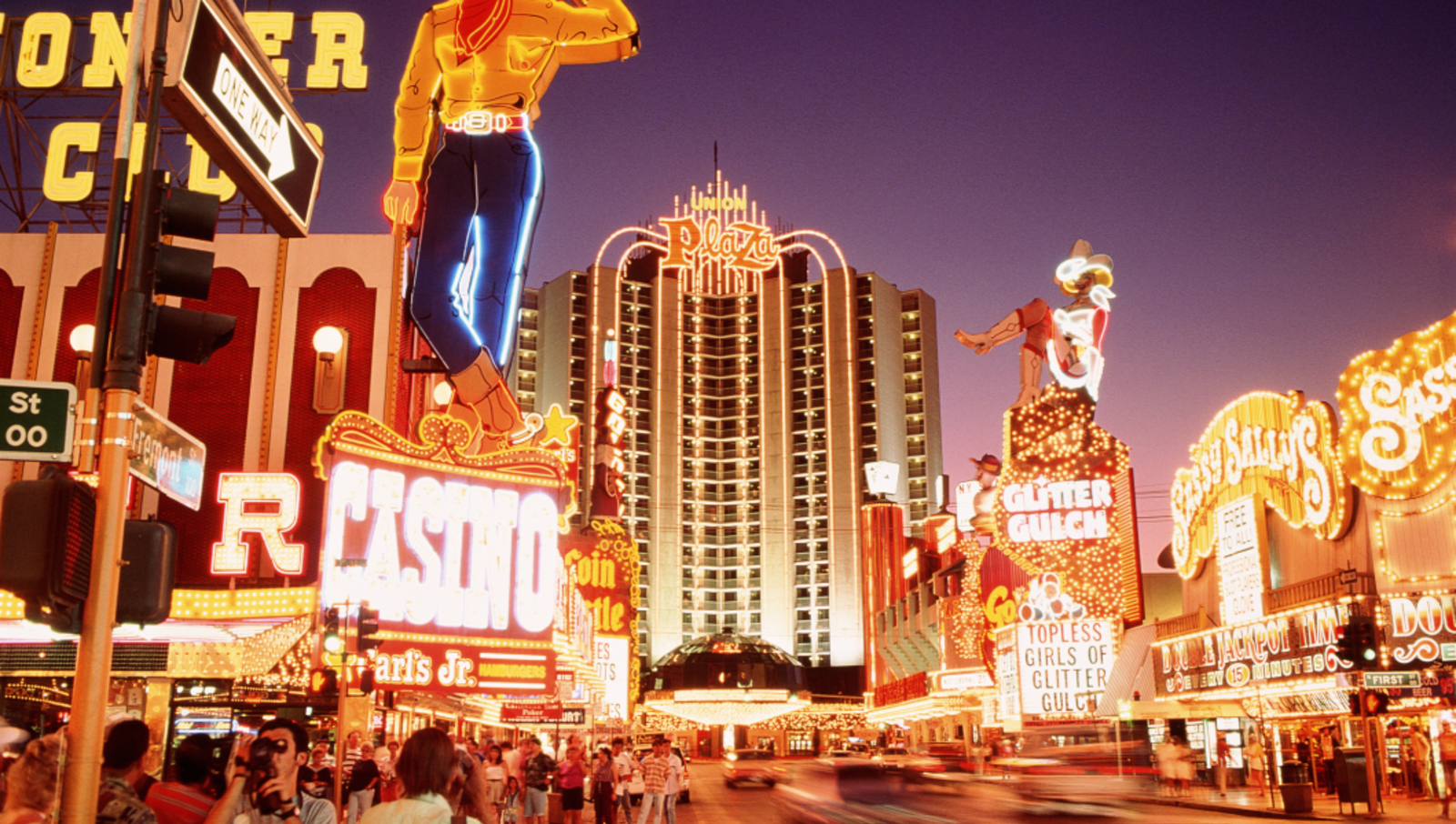 neon signs down street in vegas
