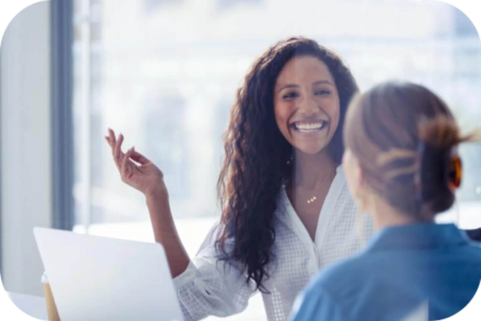 women talking with smile