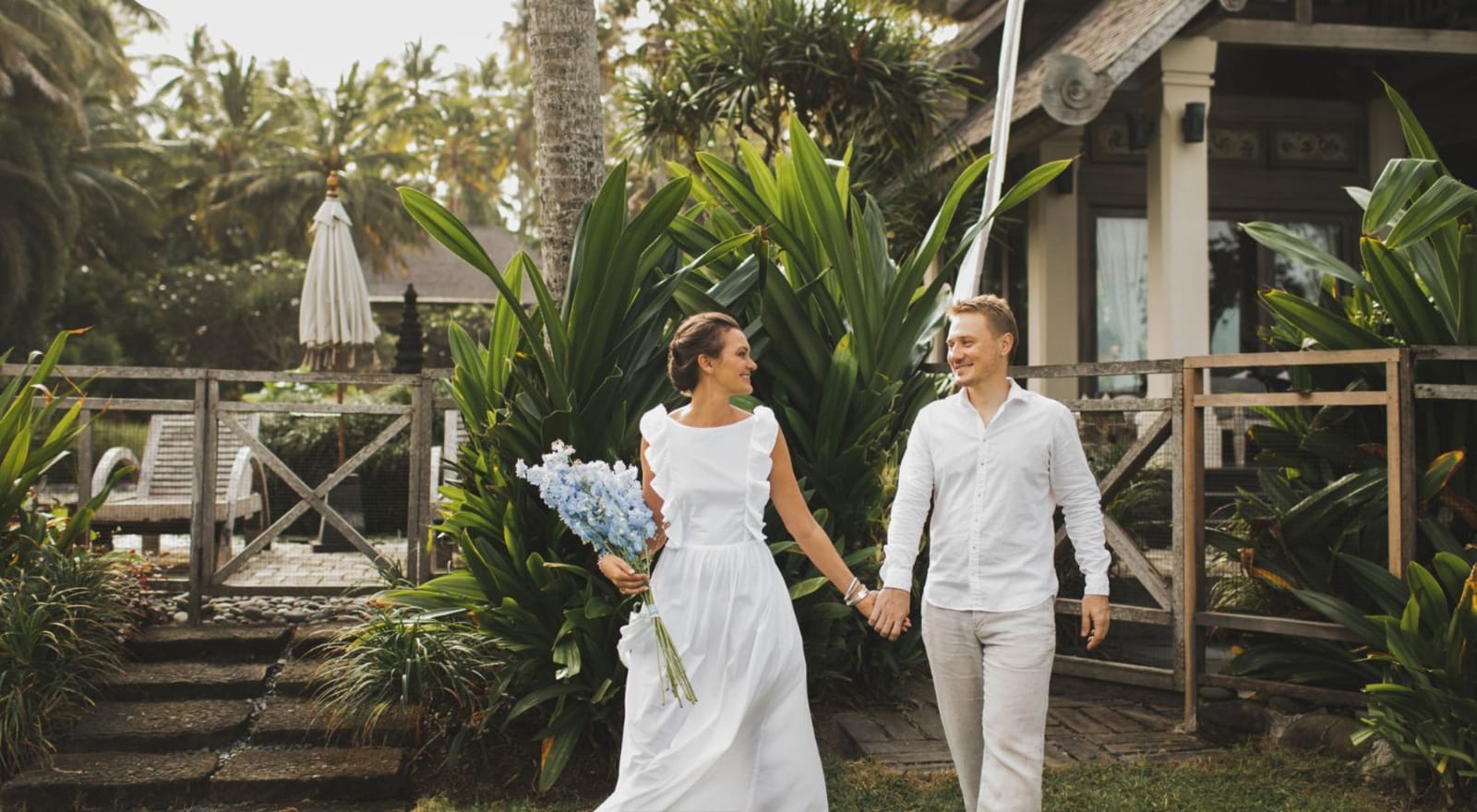 couple holding hands as they walk