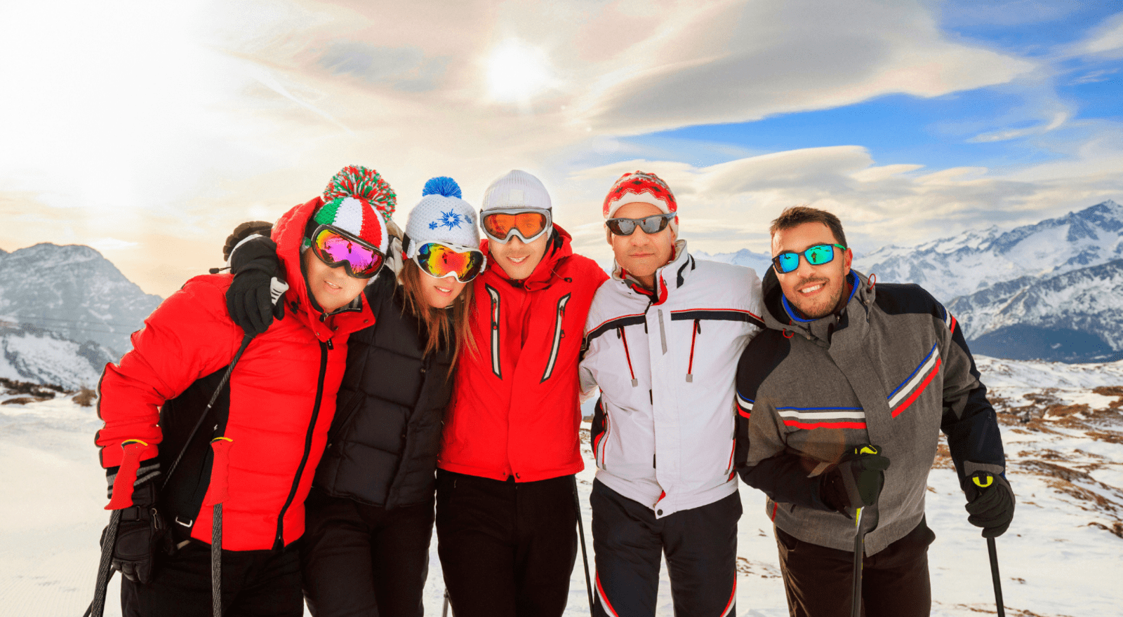 group of people taking photo together while skiing