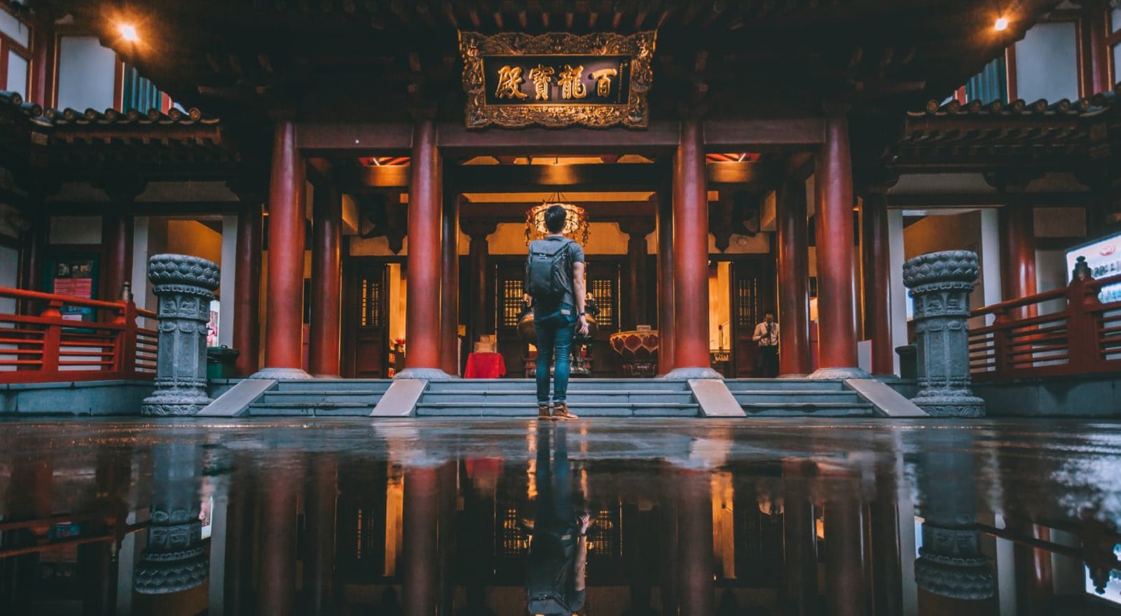 man standing in front of building in singapore