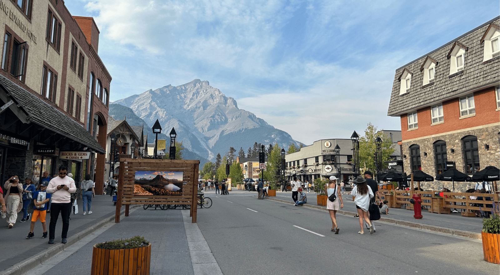 Walking down Banff Avenue with Cascade Mountain in the background