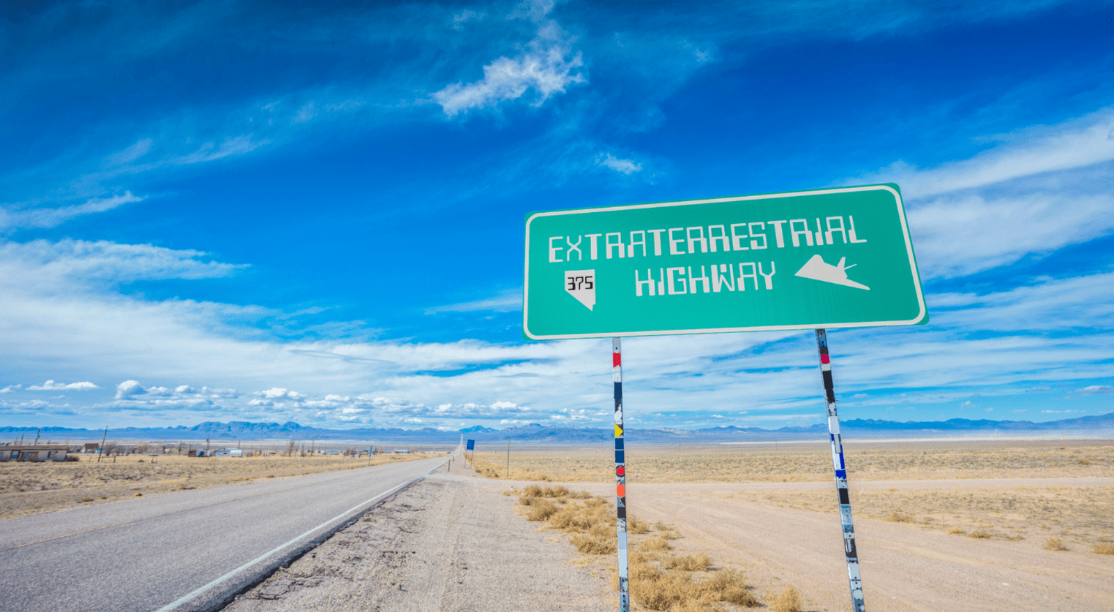 extraterrestrial highway sign by road in nevada desert