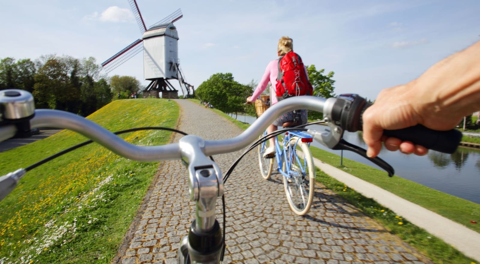 couple riding bikes in brugge