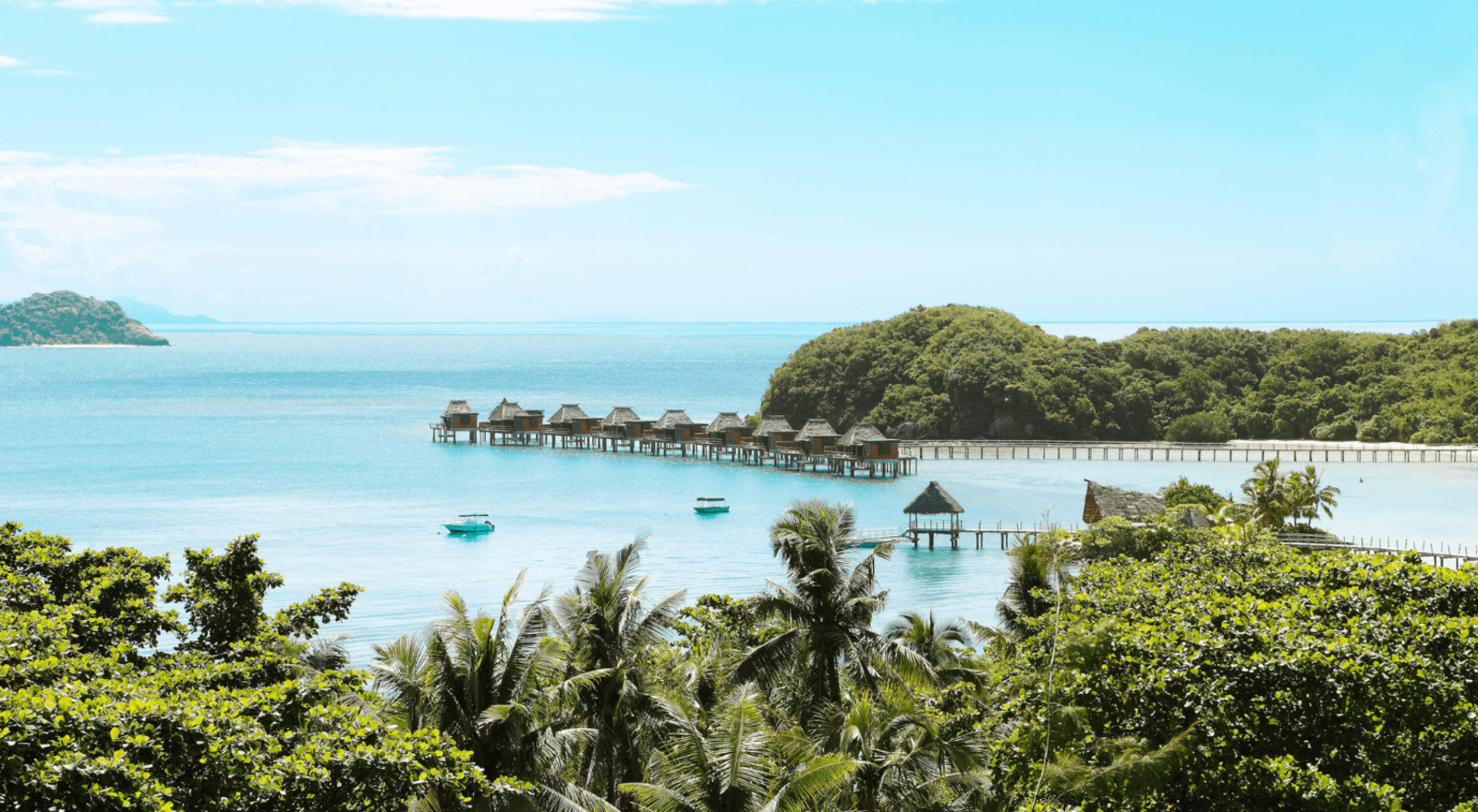 trees and over water villas in the distance in fiji