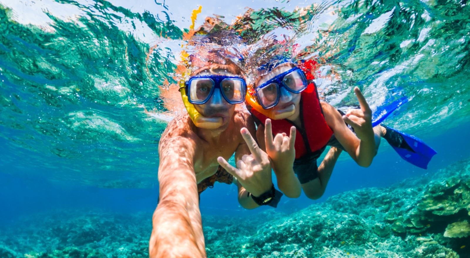 two people taking a selfie underwater in fiji