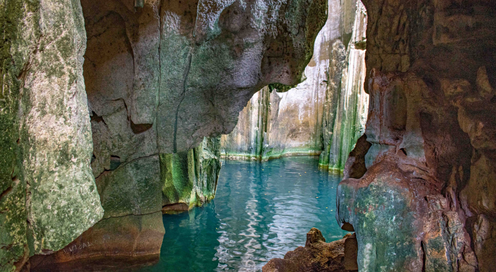limestone caves with blue water 