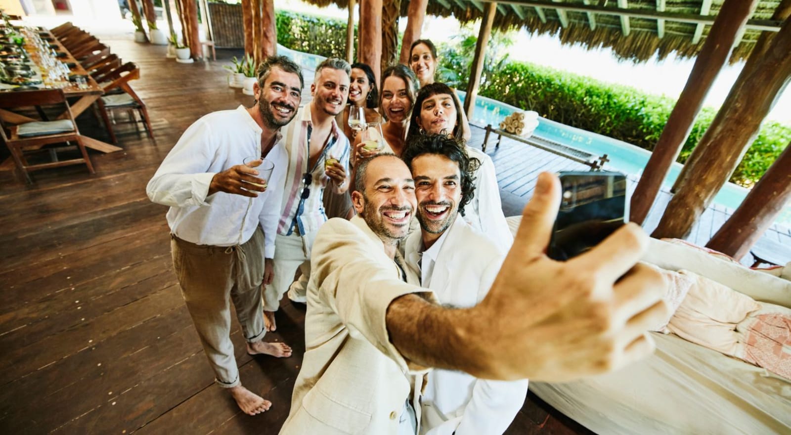 group of friends taking selfie at destination wedding venue