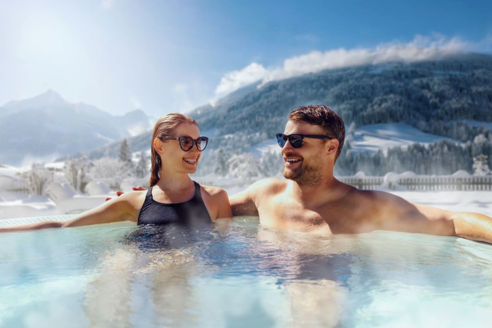 Couple in hot tub at a mountain resort