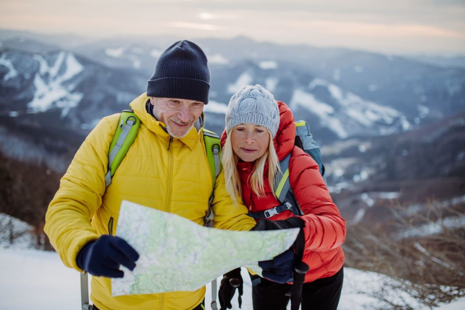 Couple looking at cross-country ski trail map