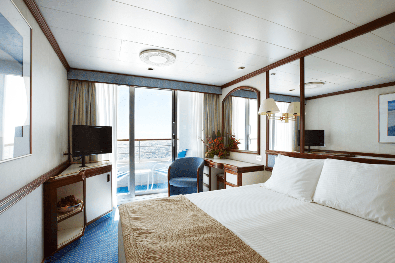 Looking out to sea from the interior of a stateroom on a cruise ship