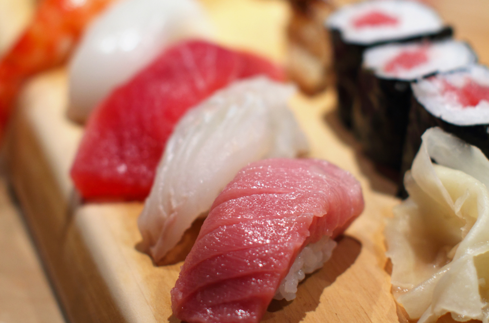 A selection of sushi plated up and ready to eat.