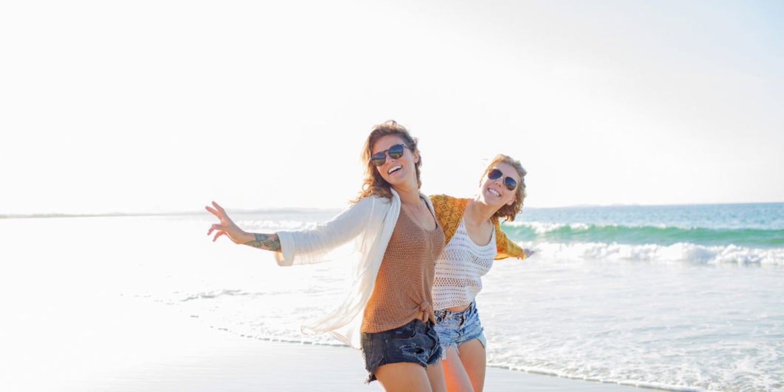 Two people having fun on a beach