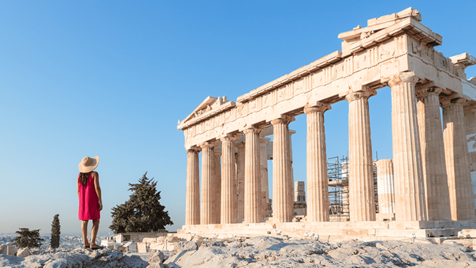 The Acropolis of Athens, framed by a bright blue sky