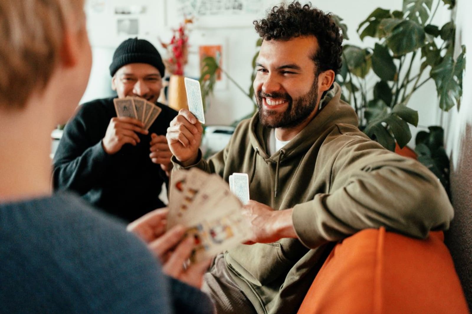 Group of friends playing a card game