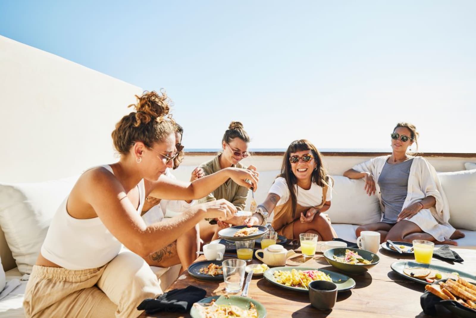Group of friends sharing a meal while on vacation