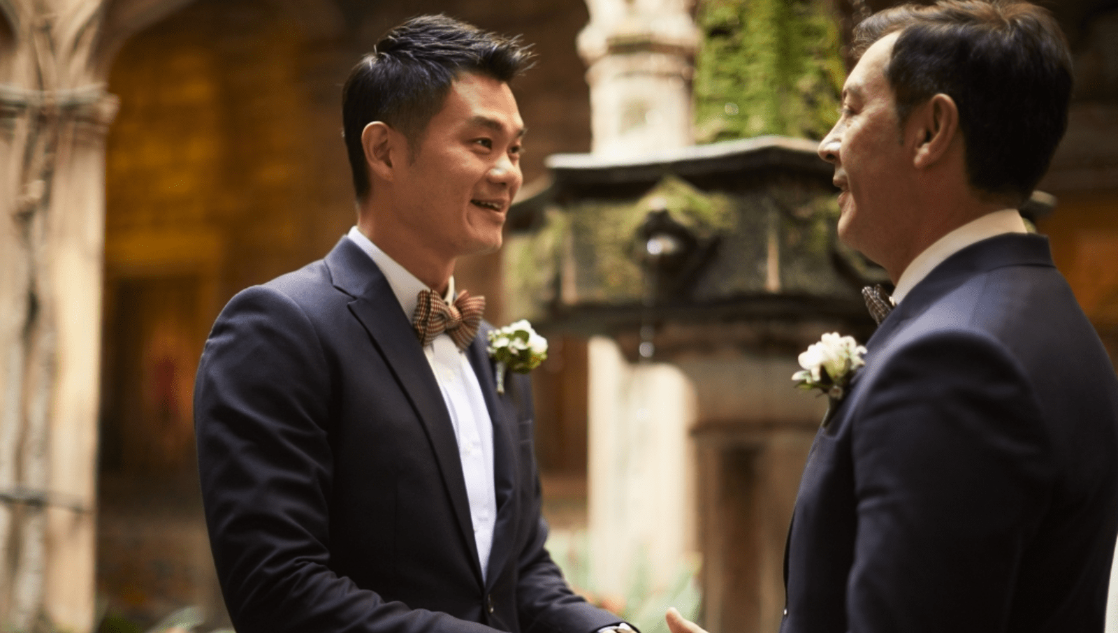 queer couple in tuxedos getting married in Spain