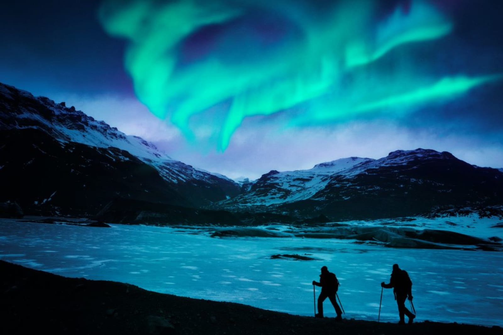 Hikers under the Northern Lights