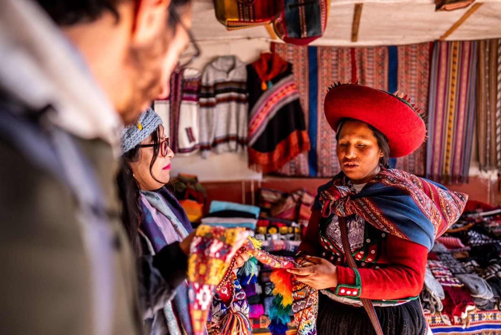 Indigenous woman selling clothes in Peru