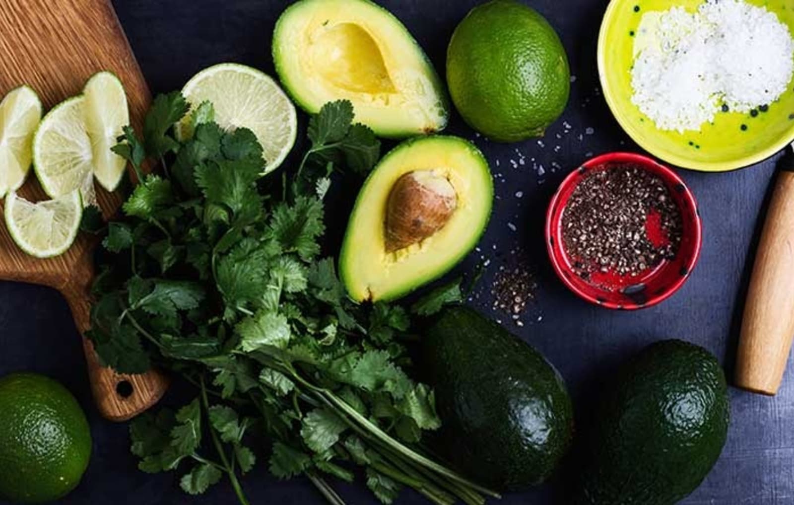 A table with ingredients used to make Mexican cuisine