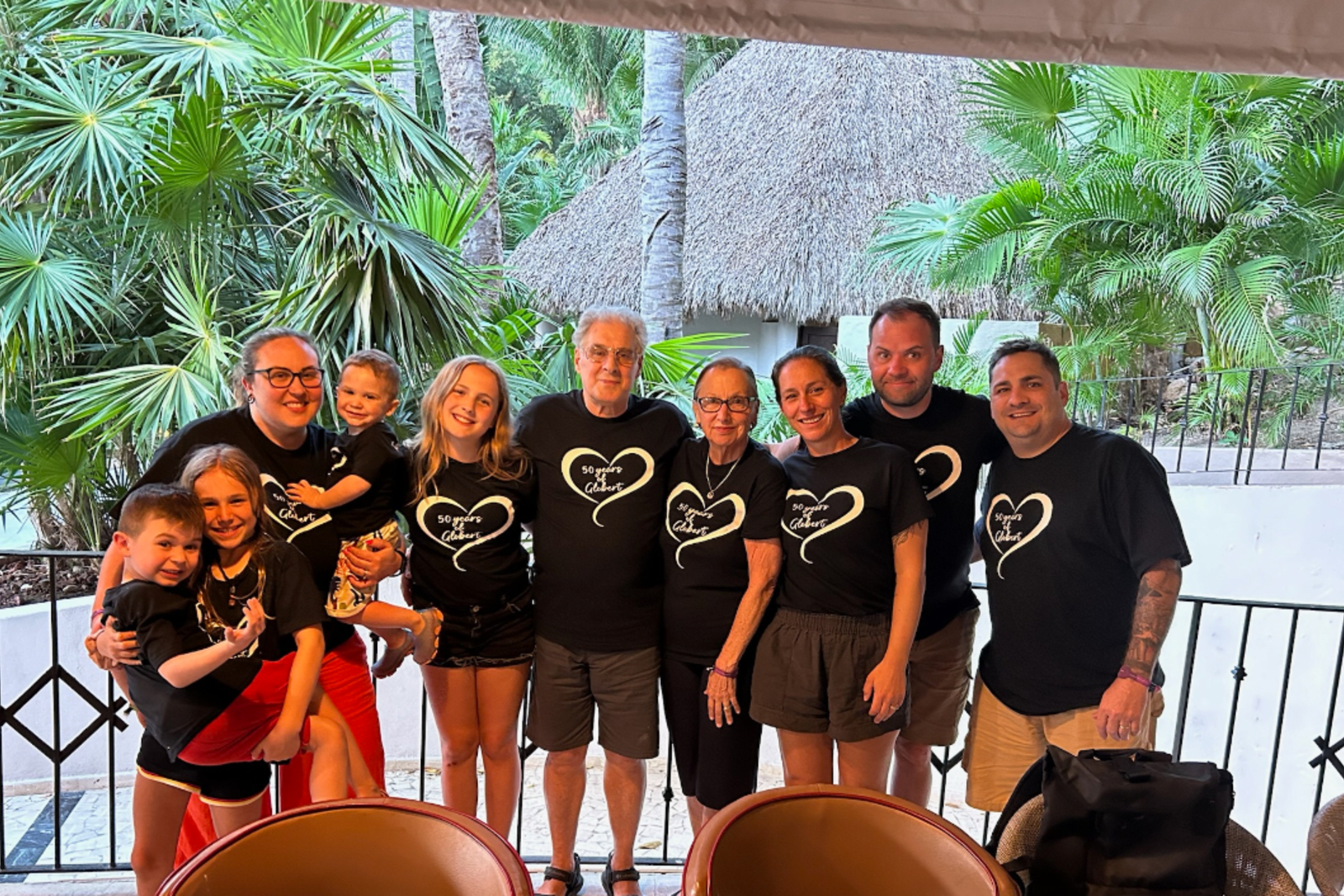 Family wearing matching shirts during multigenerational trip to Mexico