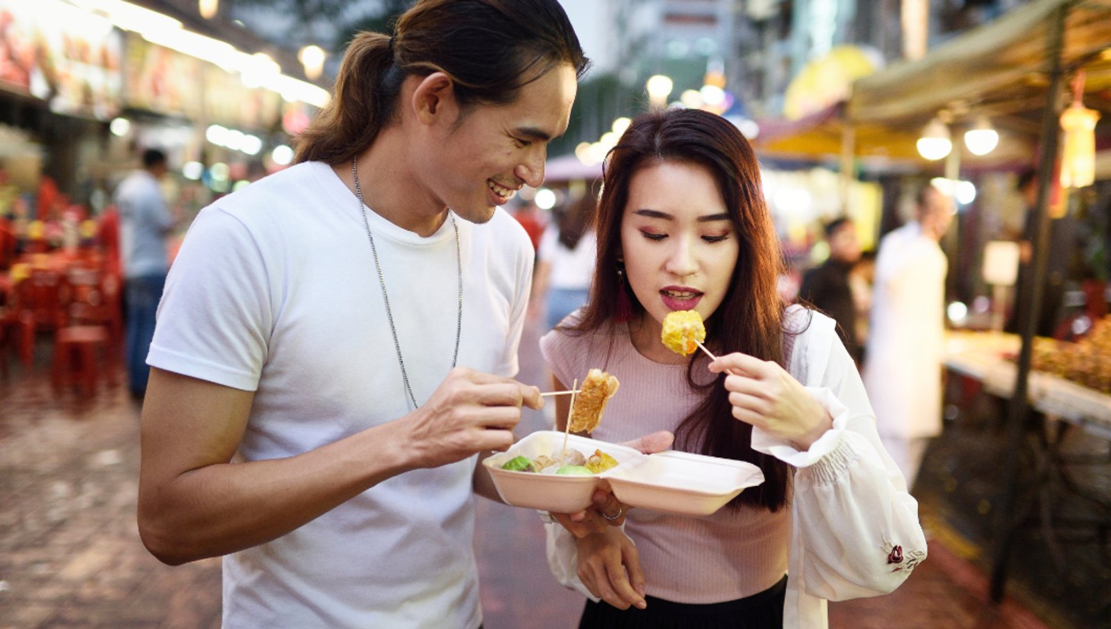 people eating at food market in Kuala Lumpur