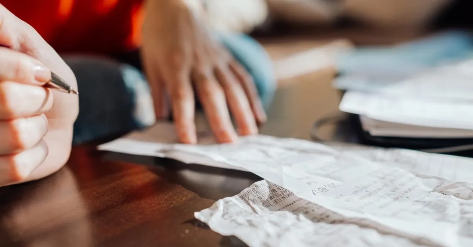 person preparing travel budget