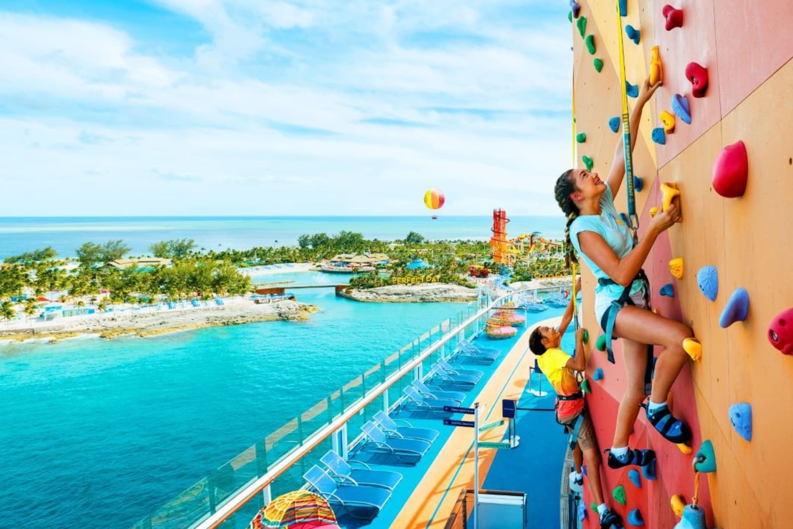 Kids climbing a rock wall aboard a Royal Caribbean cruise ship