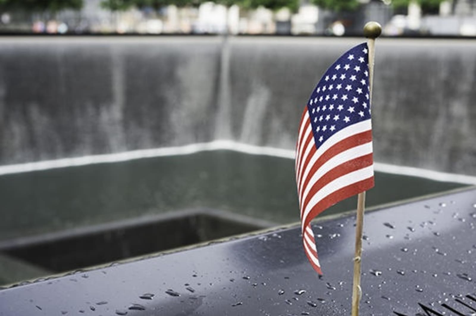 American flag blowing in the wind at Ground Zero.