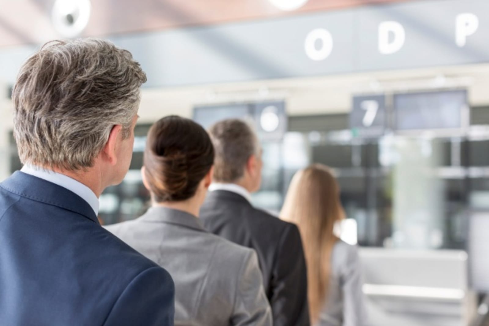 People waiting in line at airport
