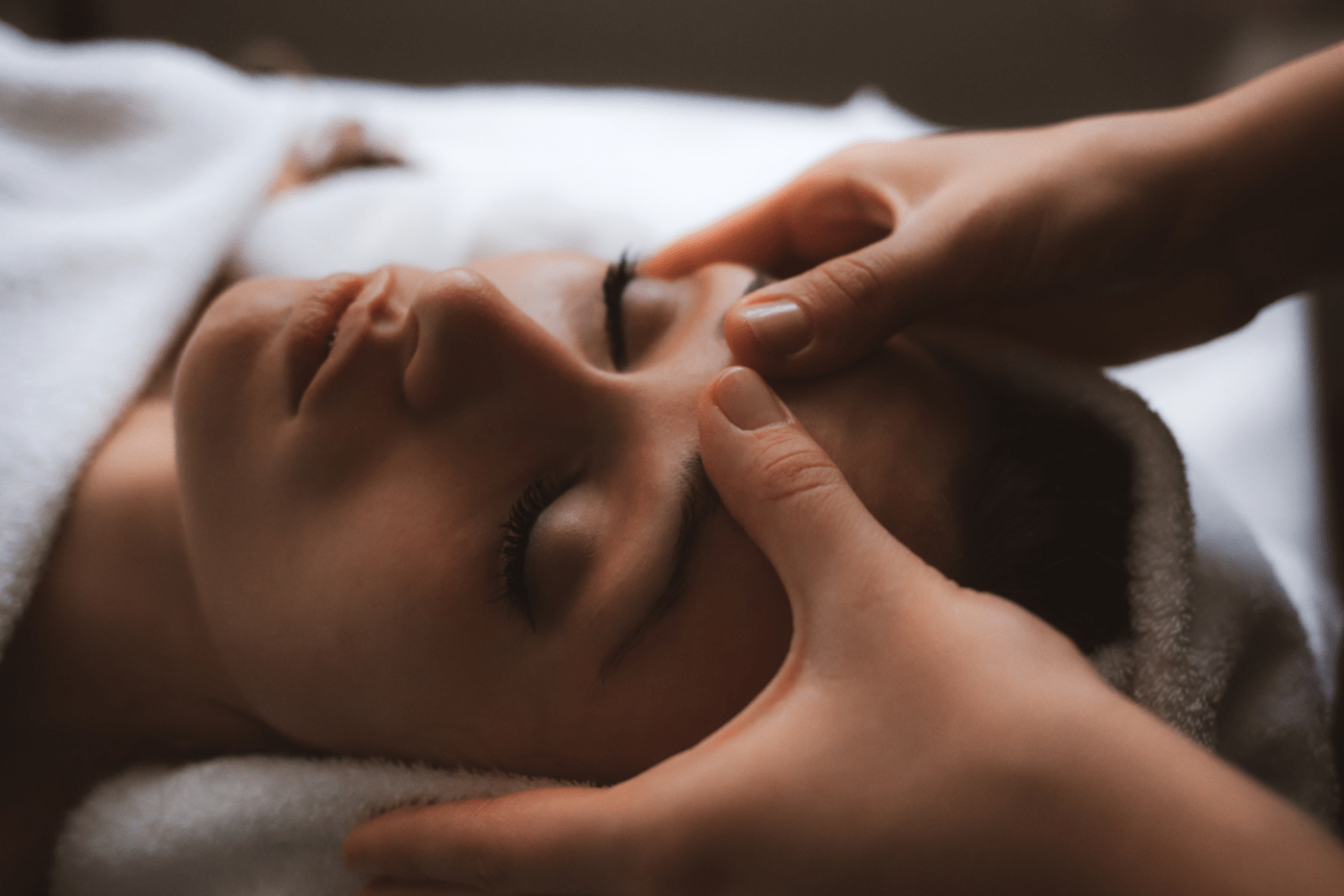 Woman getting a relaxing head massage