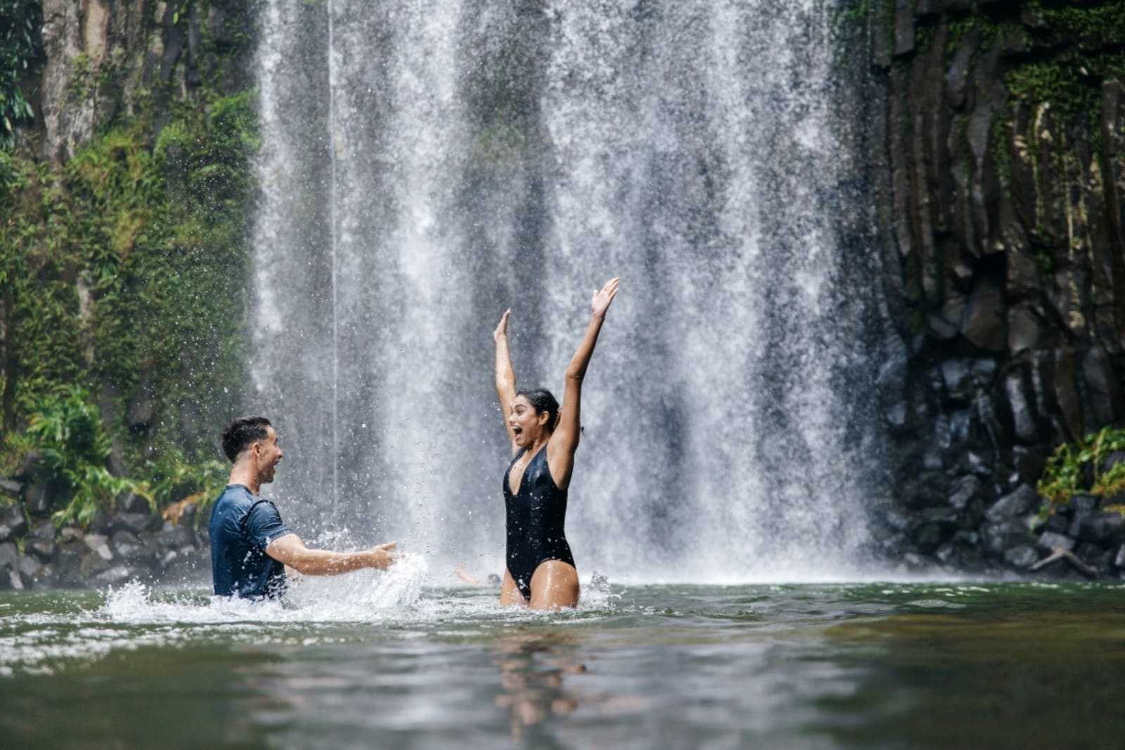 Travellers swimming in Millaa Millaa Falls