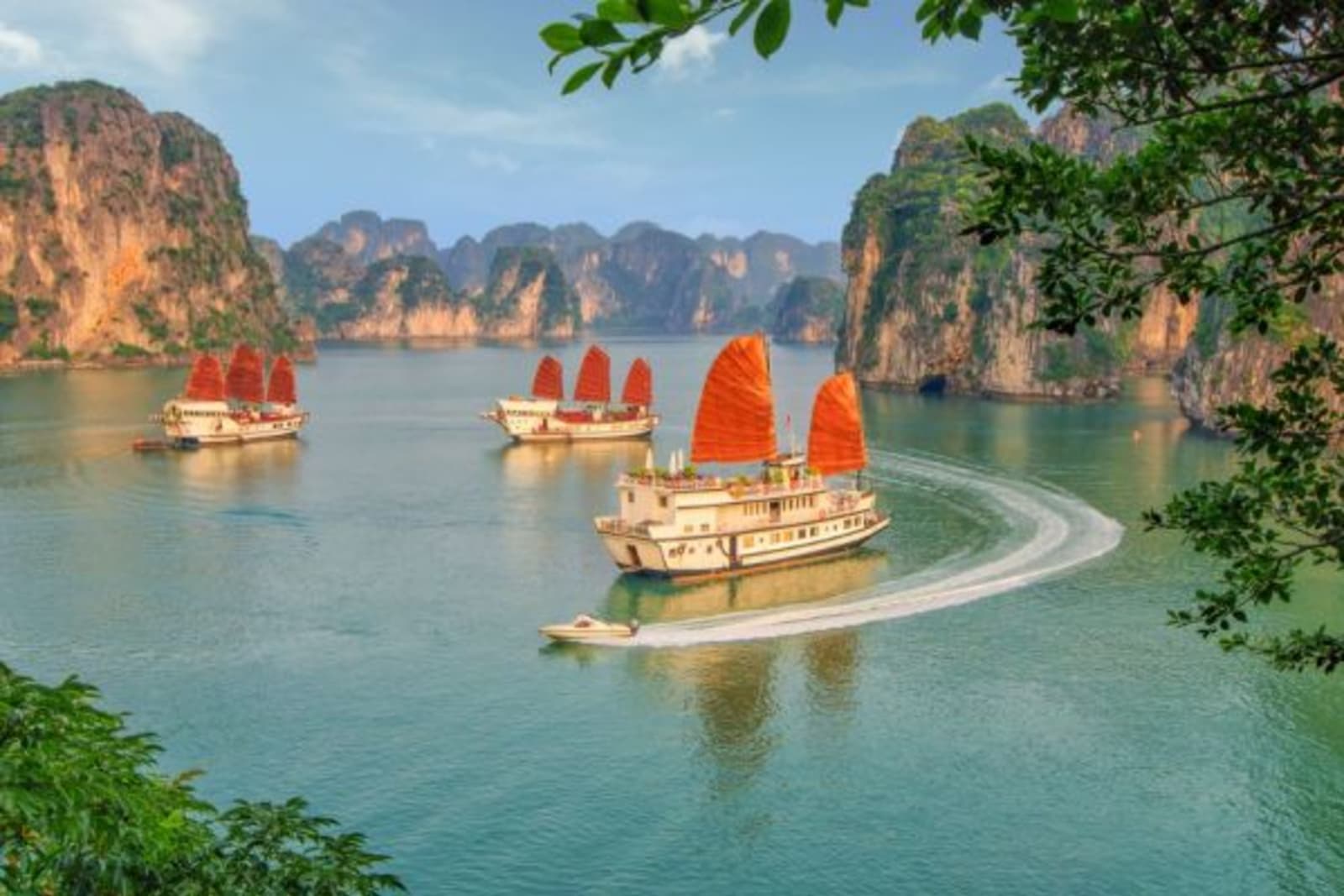 Traditional sail ships floating in Ha Long Bay