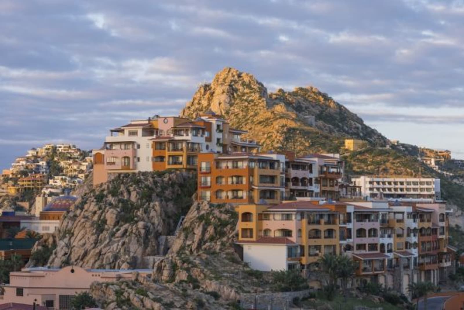 Hilltop houses with sunsetting in Los Cabos
