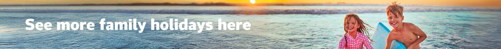 See more family holidays here - kids holding kickboards in the ocean at sunset