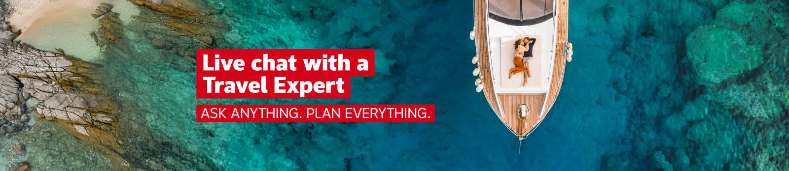 Live chat with a Travel Expert - ask anything, plan everything | Top down shot of a couple lying down, hugging on the deck of a sailboat