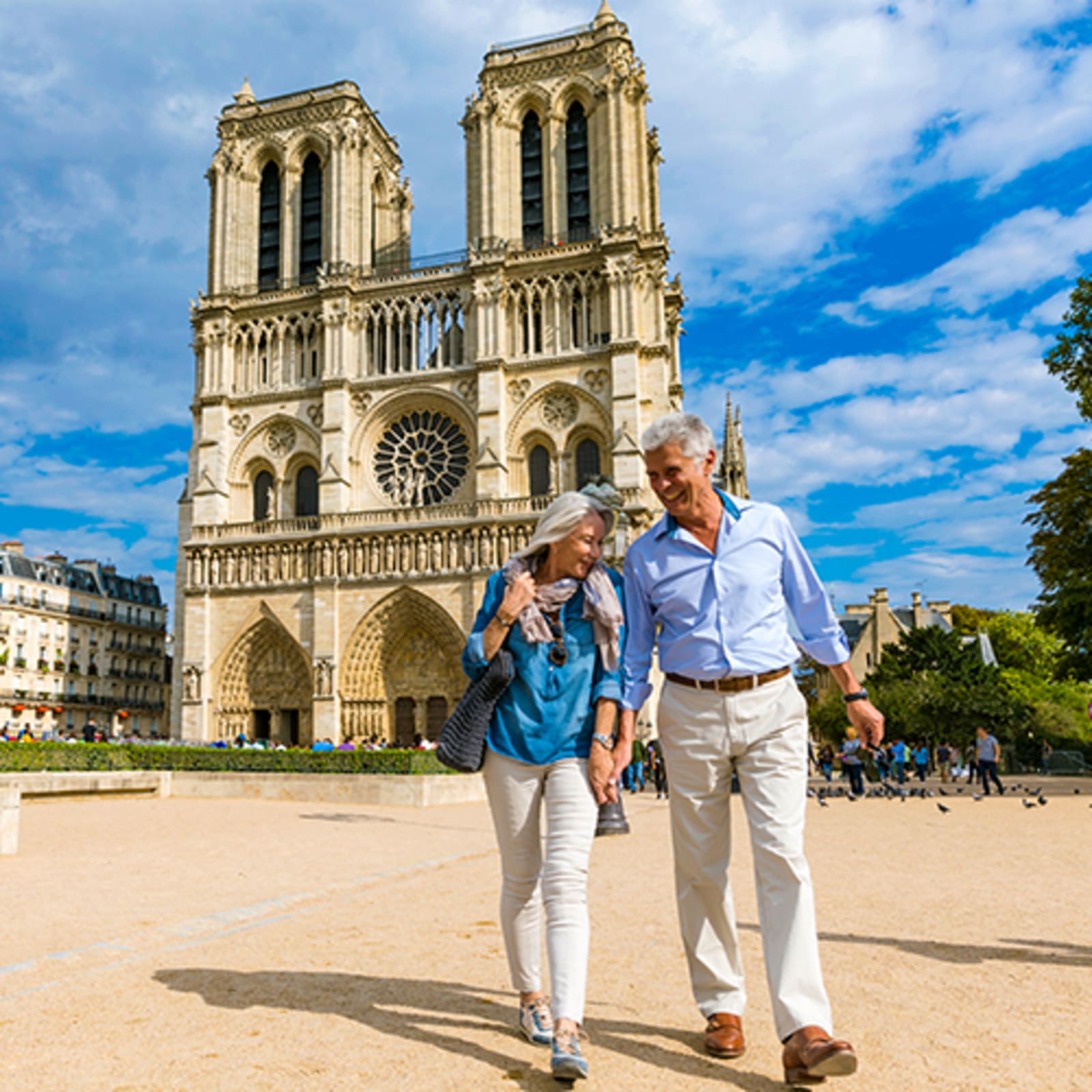 Elderly couple with Notre Dame in the background
