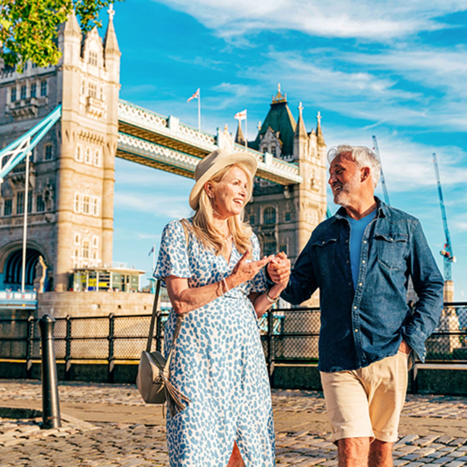 Elderly couple standing in front of London Bridge
